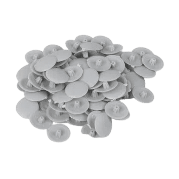 puñado de cubiertas plásticas para tornillos de color blanco